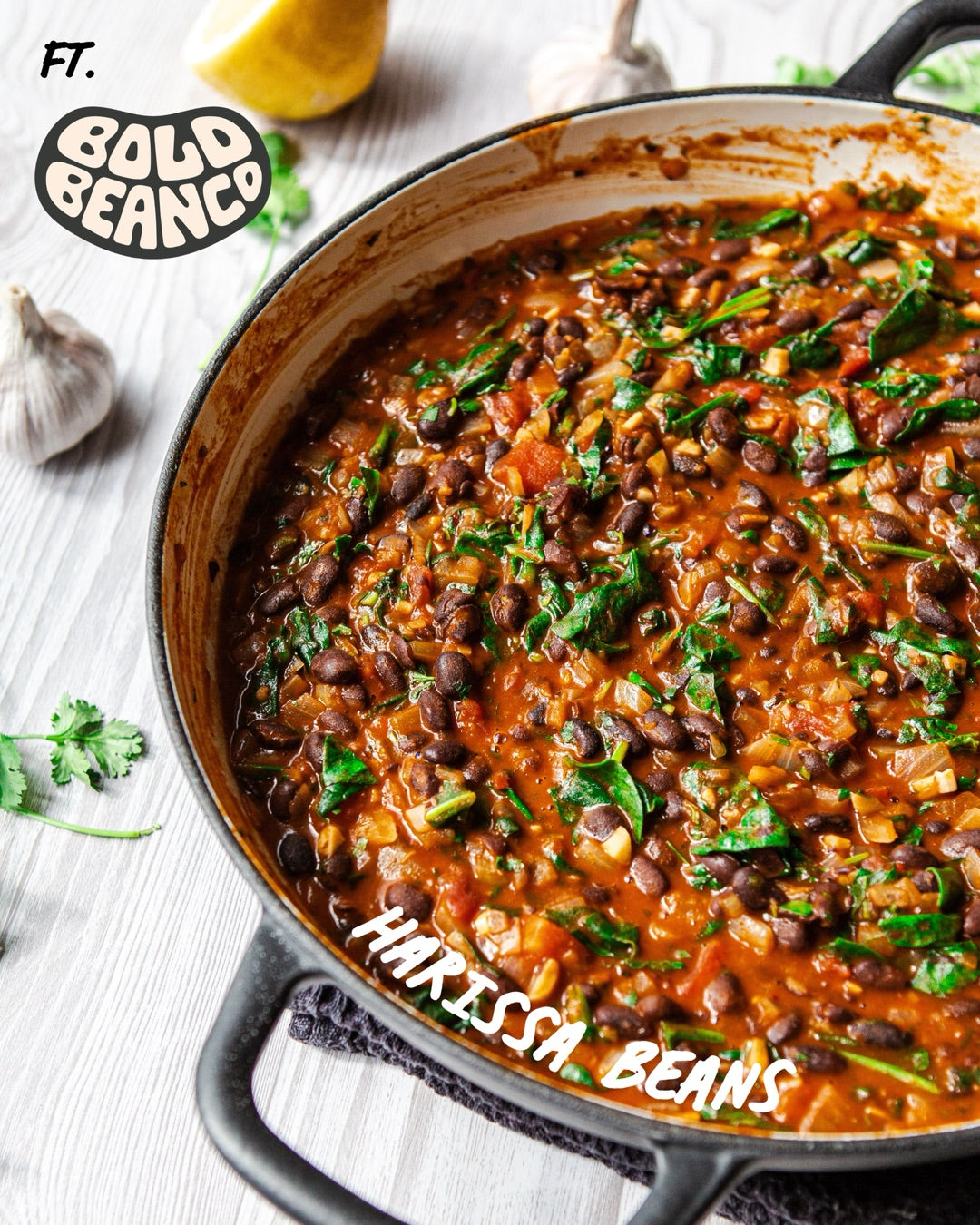 Stocked Harissa Beans in the pan with spinach, made with Bold Bean Co